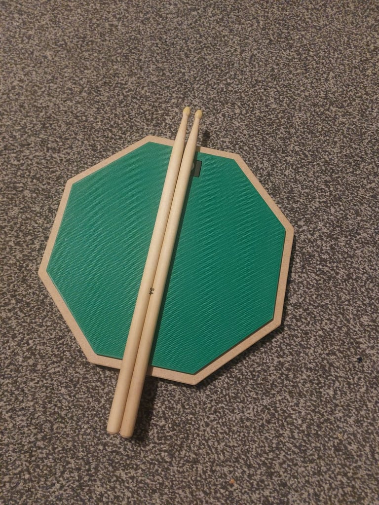 image for Drum practice pad and drumsticks 