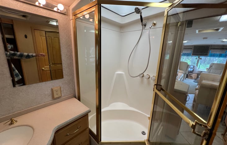 Spacious shower with 10 gallon hot water heater.