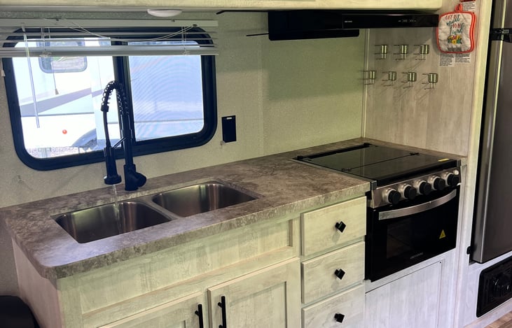 Kitchen sink, drawers, and stove