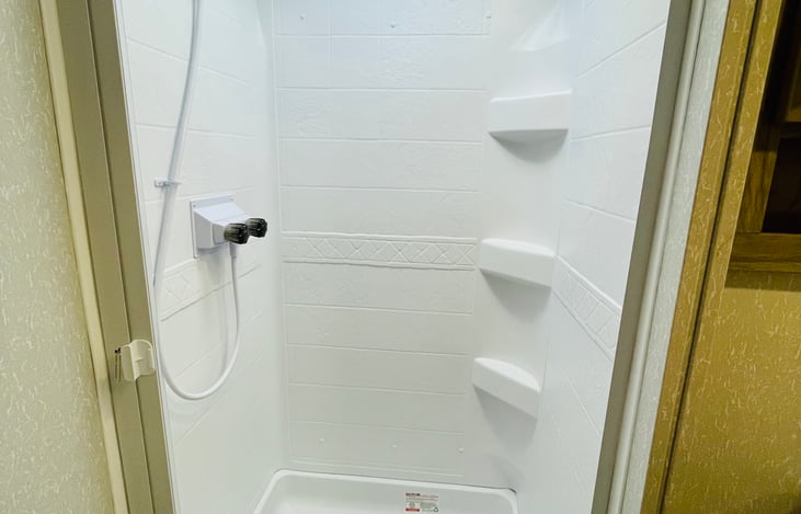 Nautilus Style Shower with Retractable Splash Proof Door. Shower Skylight. Motion Sensing Night Light in Bathroom