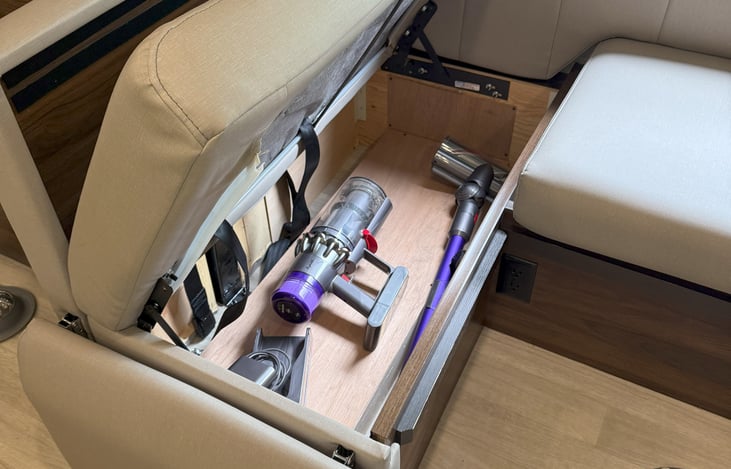 dyson vacuum under left dinette seat & outlet at bottom
