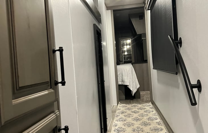 Hallway leading to loft bunk, bathroom, and main bedroom