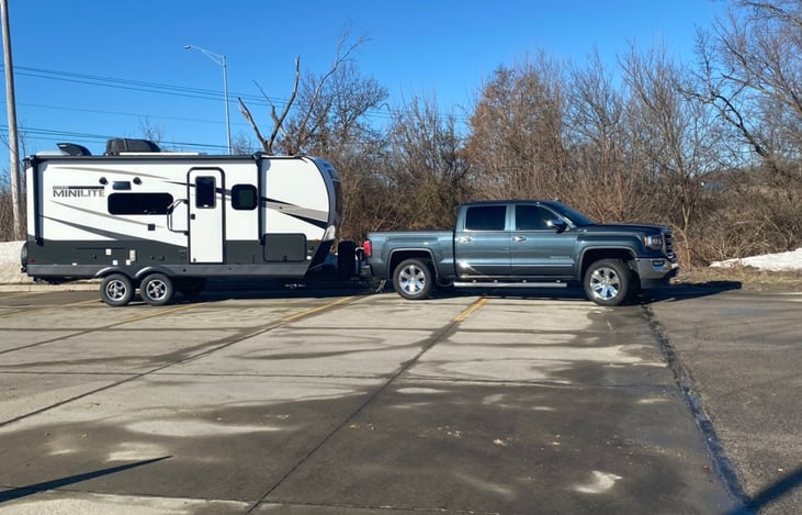 Camper perspective towed behind a 1/2 ton truck
