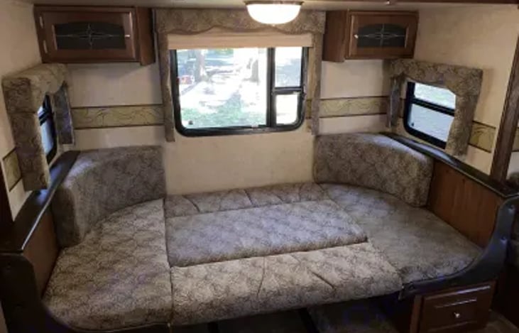 Dinette area converted to large sleeping area.