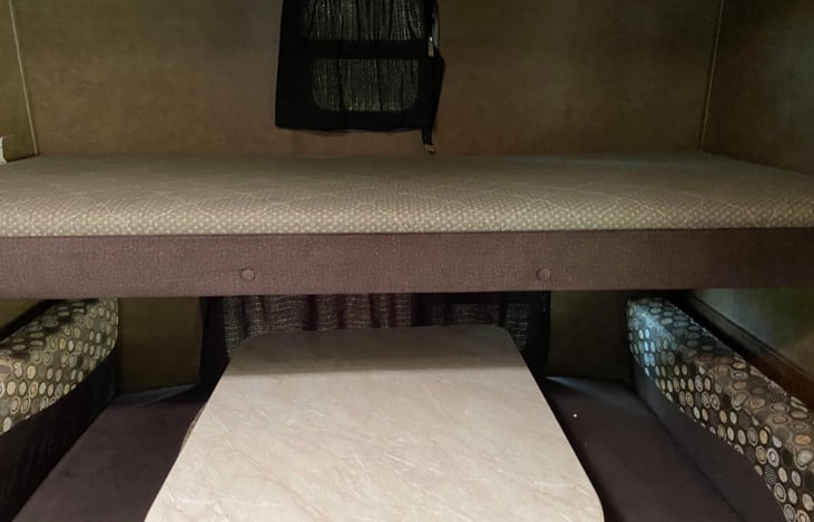 Back bunk room. 

Dinette that folds into double bed with top bunk.