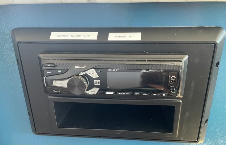 Radio with bluetooth capability that connects to the interior and exterior speakers.
