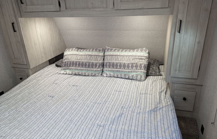 Master Suite has a King size bed with storage under, along with the cabinets around the bed.