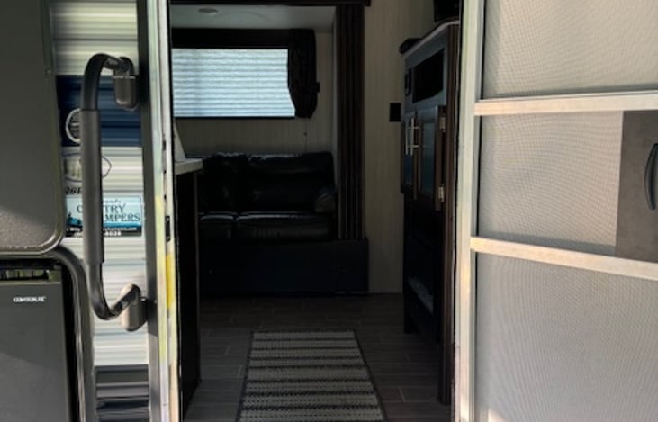 This is the main entrance into the camper, which brings you into the kitchen/living room area.