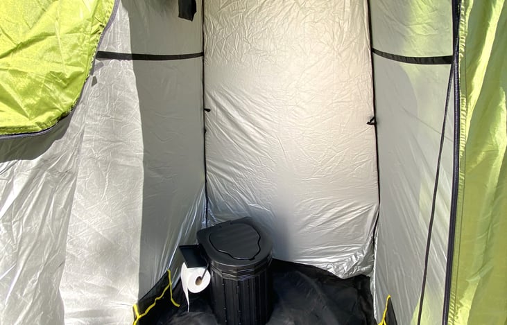 This is our portable toilet setup you can book as an add-on. It's a lifesaver when going off the grid. It's a stable toilet with toilet paper holder and everything you need to use it. It sets up easy.