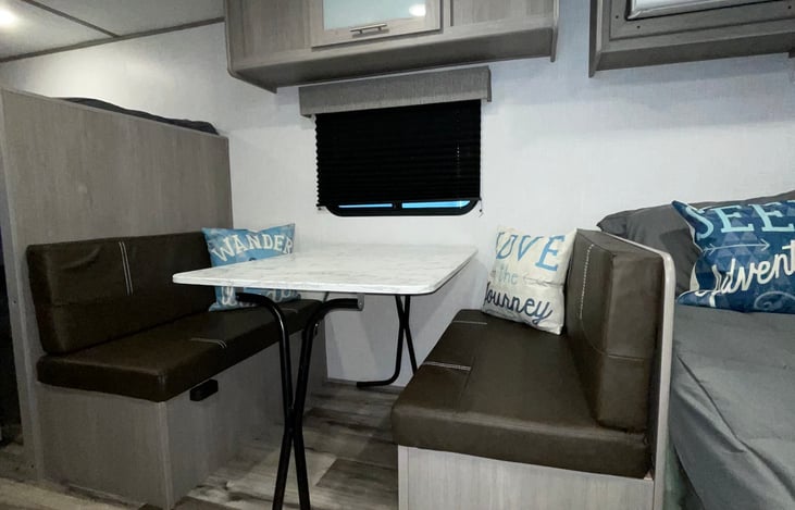 Dining area that converts to a bed.