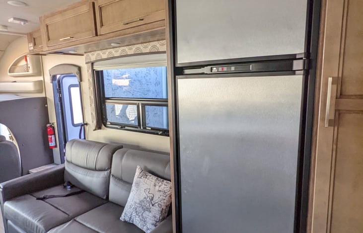 Good size refrigerator, sofa folds out to a bed