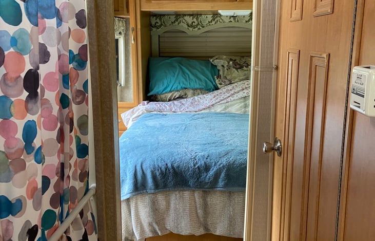 Queen bed in back of RV