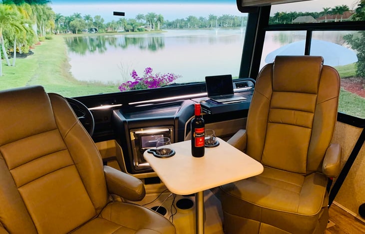 Driver and passenger seat swivel. Enjoy a film with the family in the theater style seating area!