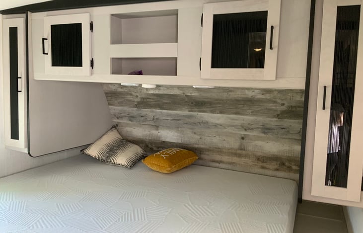 King size bed in private room with Smart TV.