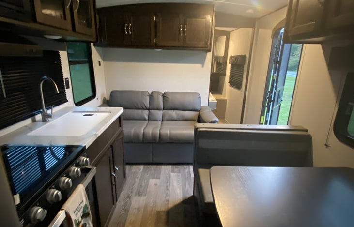 Couch is off the kitchen and dinning room area.  This also opens up to more sleeping space if needed.