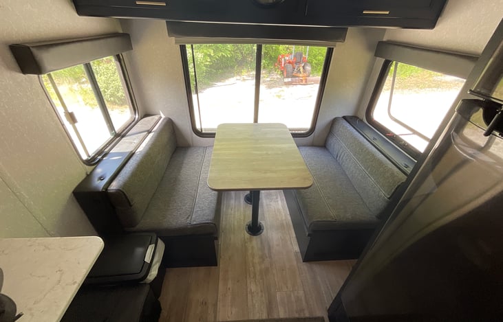 Dining area. Can be converted to bed. I do not include bedding for this. Please plan trip accordingly. Above dining area I keep a blanket for pups! So your best friend has something to lay on!