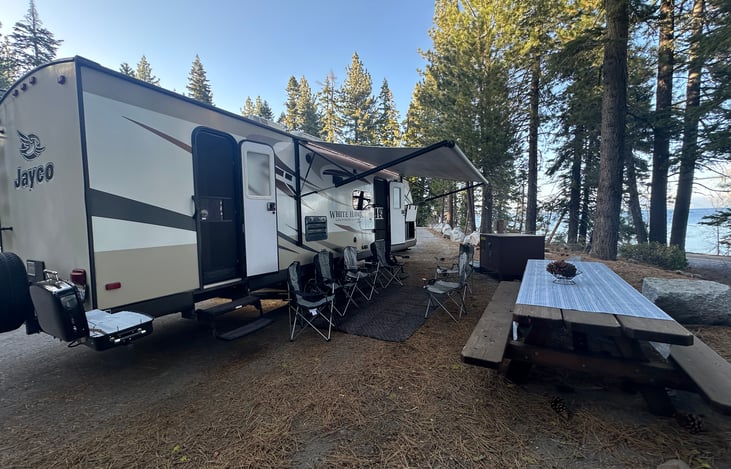 Full size electric awning, 6x camp chairs and table cloth included.