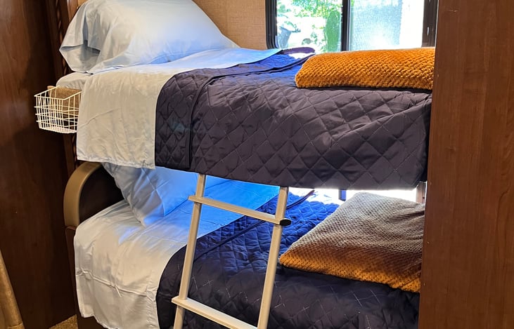 Twin bunk beds area with a curtain for privacy, or for those who may need to sleep in.