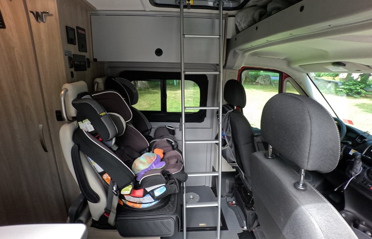 With access to pop-up tent with no need to take the car seats out.