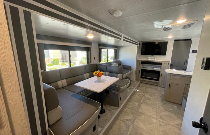 Living space has a large Smart TV and Bluetooth Stereo with indoor and outdoor speakers!