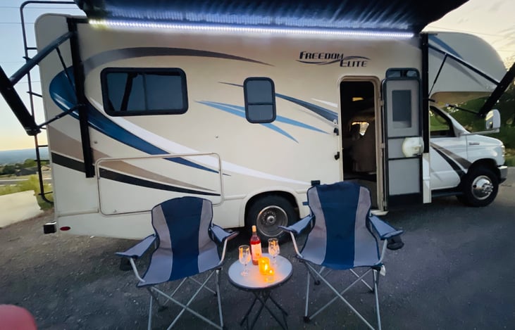 String light on awning and camp chairs for 5. Bring your own wine? :)