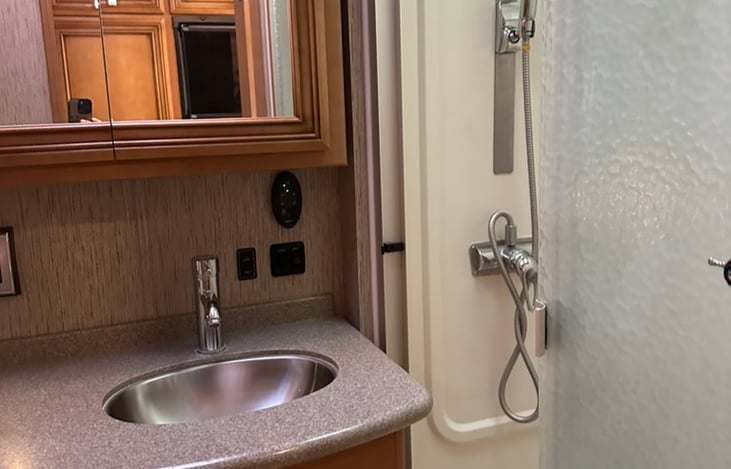 Walk in shower with adjustable shower head