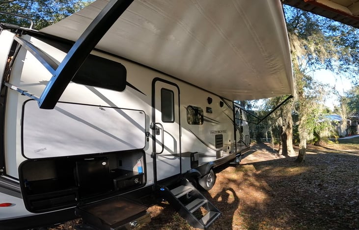 Awning to stay out of the sun while enjoying the music with built in outdoor speakers. Even the cook is protected by the sun.