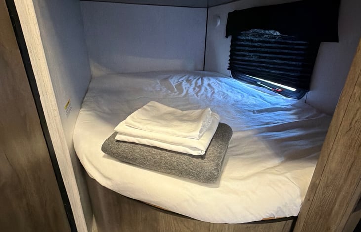 Included with Linen package. Bunk beds are made and blanket, sheet, and pillow cases provided. As pictured above.