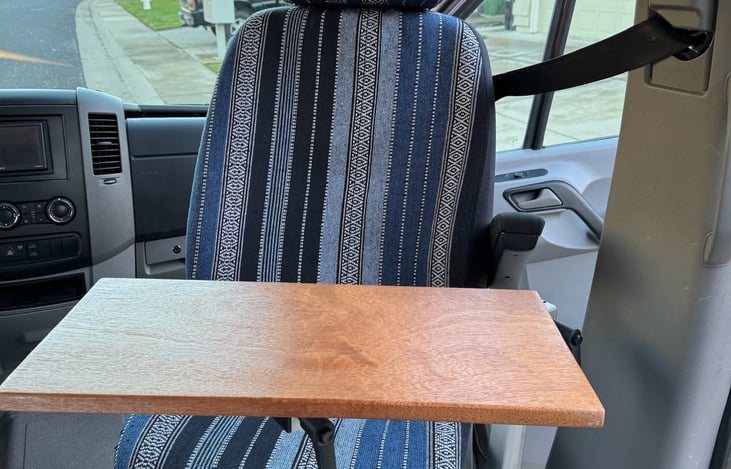 Passenger seat can swivel to face the rear with removable Lagun swivel table