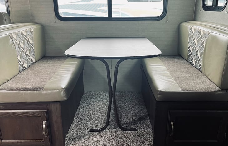 Dining table can also turn into a bed that sleeps 1 adult or 2 kids.