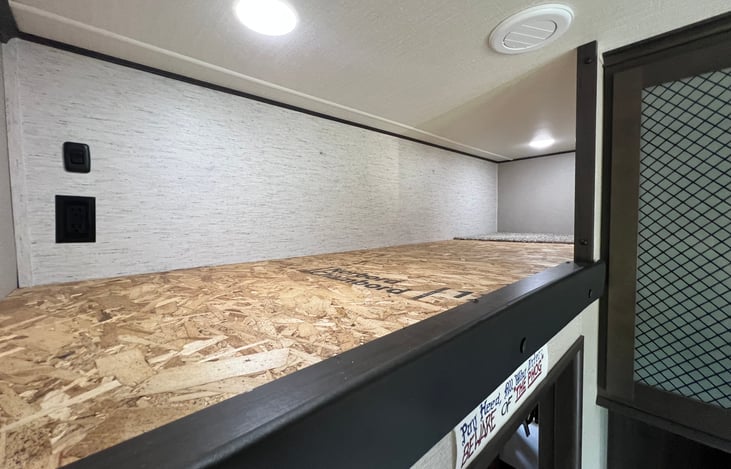 The overhead bunk is better as attic storage for luggage or other things you'd rather not keep in the pass through