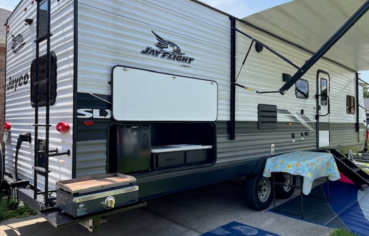 Outdoor kitchen (sink and refrigerator) & Blackstone grill.