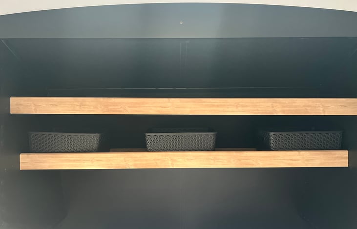 These baskets offer extra storage. Located above  the master bedroom above the bed on the shelves.