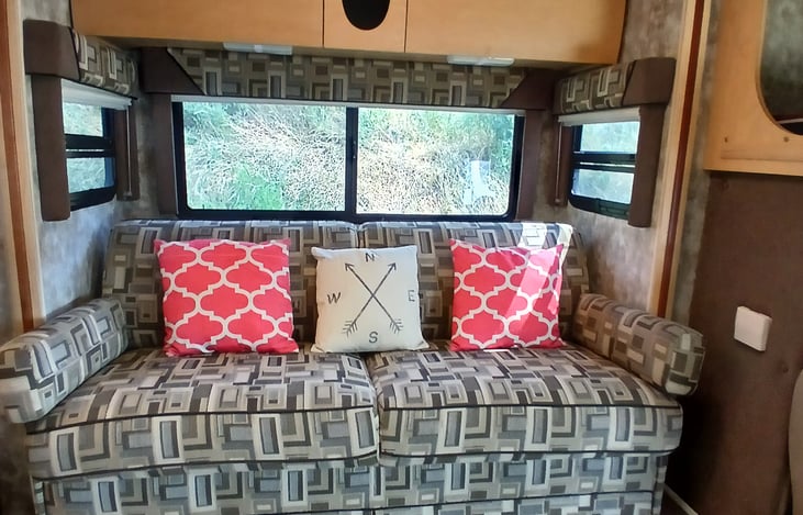 Loveseat also provides a larger dining area with installed folding cupholders on each side.