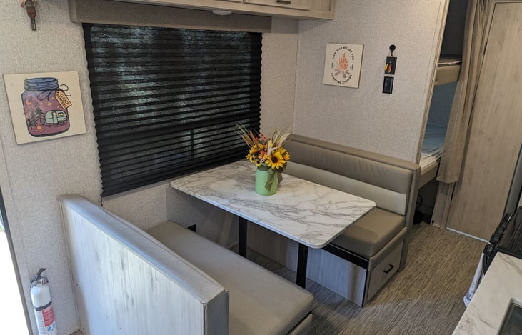 This area can double as a sleeping area, the table top drops and the padding forms the bed.