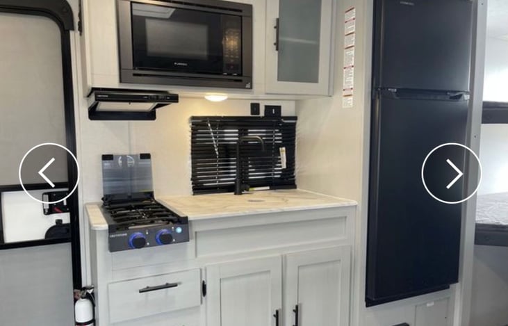 Kitchen with stove, Microwave and full-size Refrigerator and Freezer