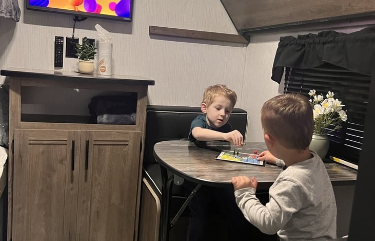 Optional table conversion on lower bunk has storage in the seats.