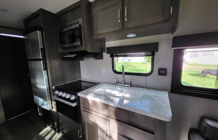 Full kitchen with fridge, freezer, microwave, stove and oven and lots of cabinet space