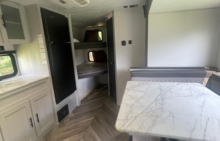This dinette converts to a bed, plus the 2 bunks!