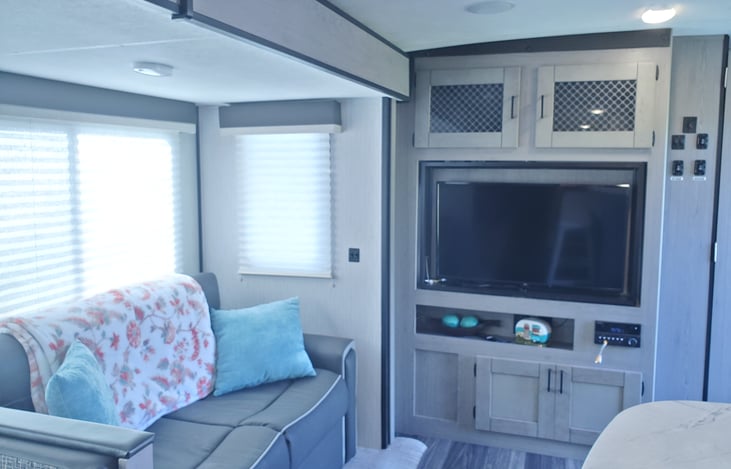 Living room sleeps one on the pullout couch. TV with cable hook up Cd player with wi-fi connection out door speckers .