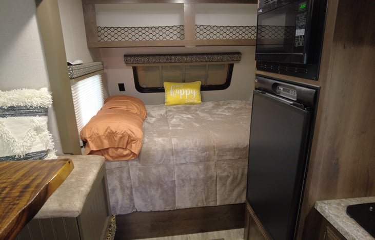 Full size furniture store mattress that was just purchased in the fall. The camper mattresses are thin and hard, this is a definite upgrade for sleeping. Bedding and pillows are included.