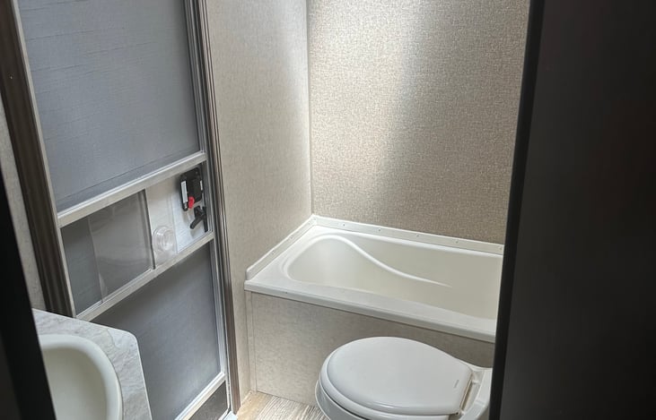 bathroom with door leading outside