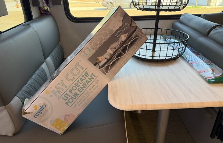 Nap cot stored under dining room bench for the little one!