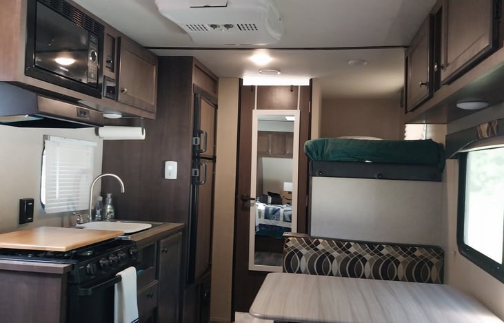 View of table and kitchen.