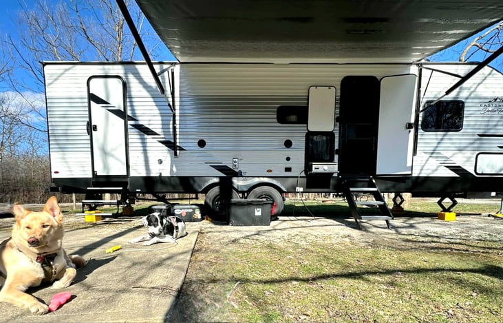 Exterior with 2 entry doors and an outdoor mini fridge and griddle