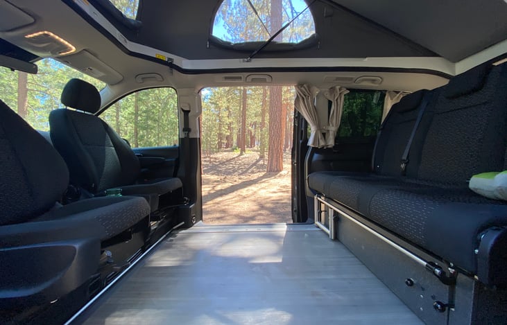 Top popped with bench in seating position. Seats swiveled around for lounging.