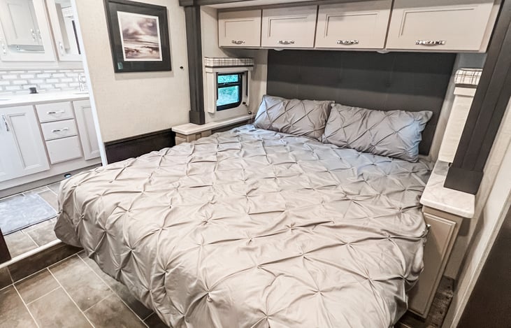 Comfortable king-size bed with hotel-quality linens for a perfect night's sleep