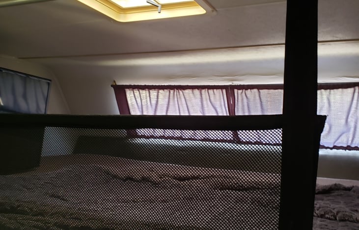 The upper bed can be used for storage with the safety net to keep items in place.