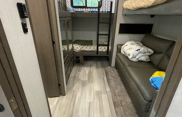 Rear bunkroom- the sofa is a pull out bed and there is a second bathroom attached to this room.