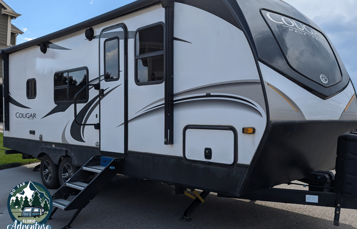 Power awning and outdoor speakers. Propane grill hookups and power outlets